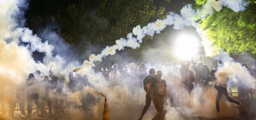 Tear gas rises as protesters face off with police during a demonstration on May 31 outside the White House over the death of George Floyd at the hands of Minneapolis Police.
