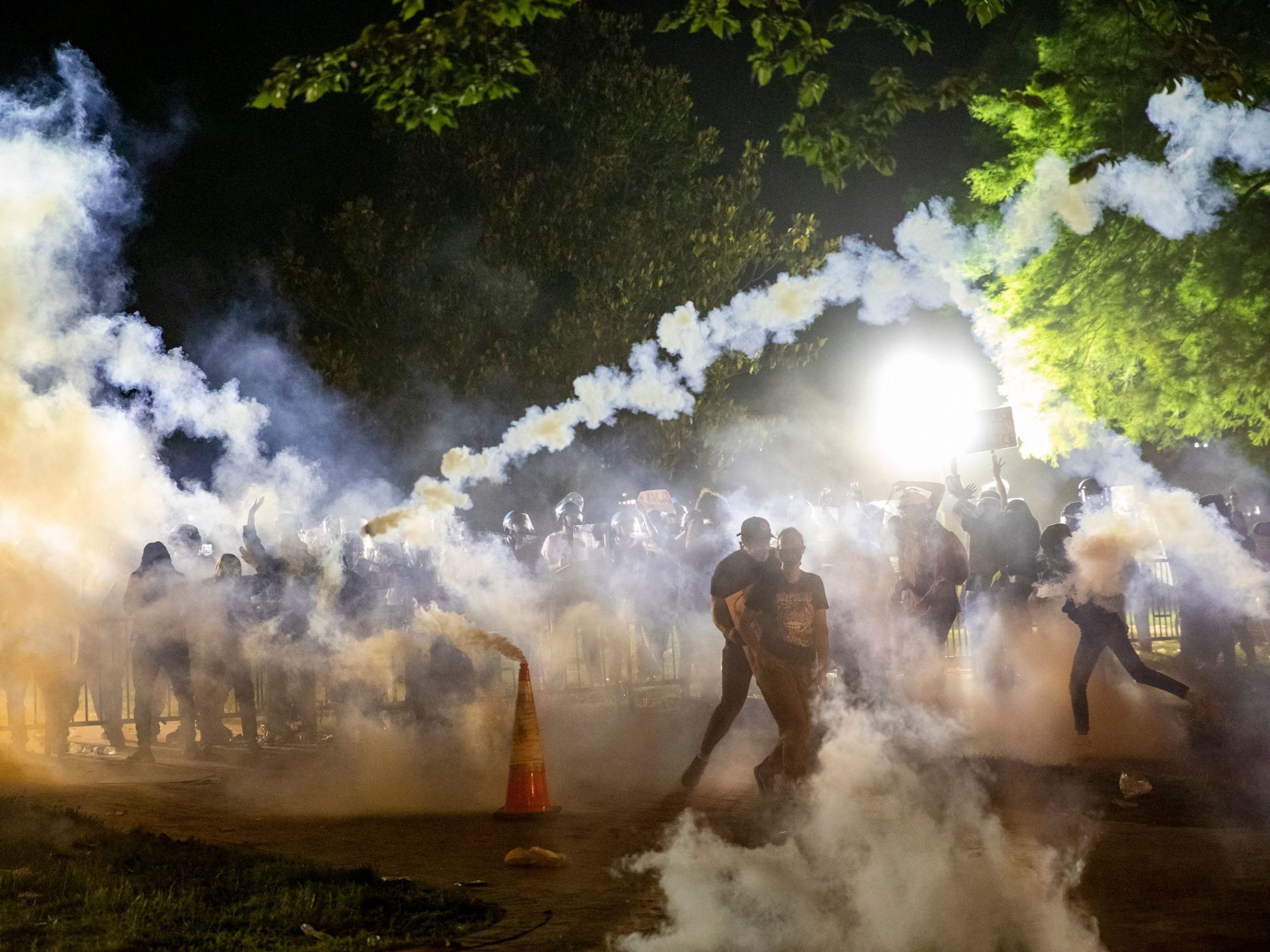 Tear gas rises as protesters face off with police during a demonstration on May 31 outside the White House over the death of George Floyd at the hands of Minneapolis Police.