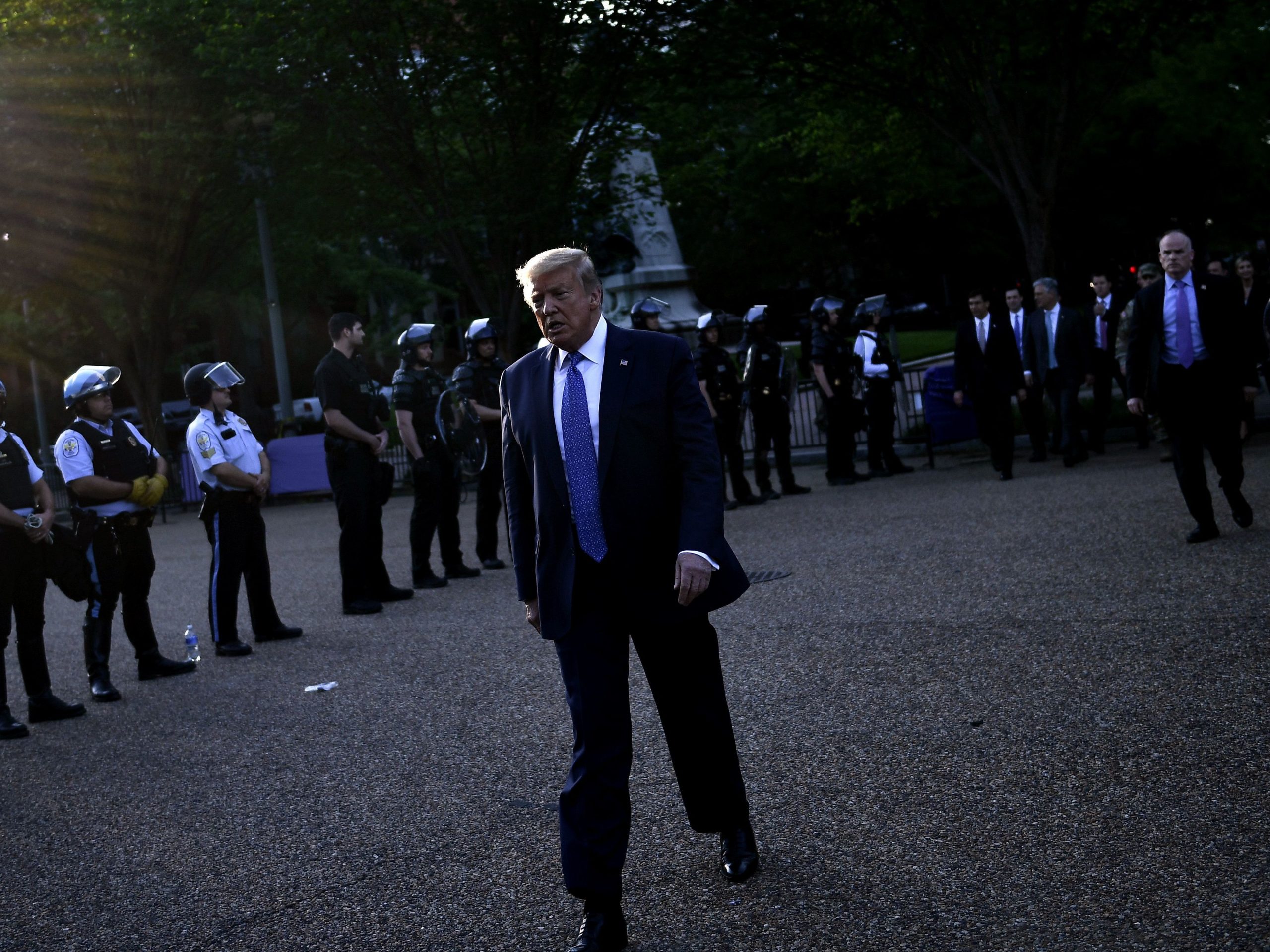 President Trump walks back to the White House escorted by the Secret Service after appearing outside of St John's Episcopal church across Lafayette Park in Washington, D.C., on Monday.