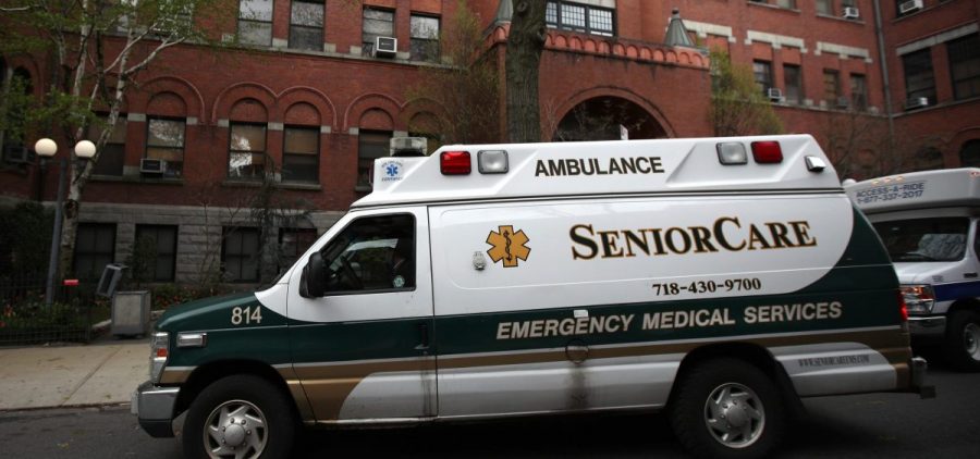 An ambulance pulls up outside a nursing home in Brooklyn, N.Y. Two members of Congress have called for an investigation of five states, including New York, which ordered nursing homes to admit patients who tested positive for COVID-19.