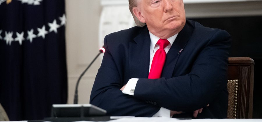 President Trump, seen here during a meeting Thursday at the White House, shared a video on Twitter with a fake CNN headline. The social media network flagged the doctored footage as "manipulated media."