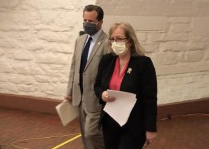 Rep. Rick Carfagna walking with Rep. Laura Lanese before announcing a bill to repeal HB6.