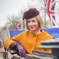 Lucy Worsley in a carriage on The Mall, London.