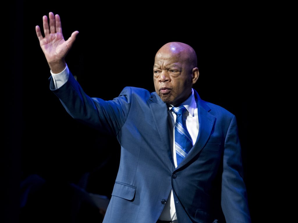 Rep. John Lewis waves during the swearing-in ceremony of Congressional Black Caucus members in January.