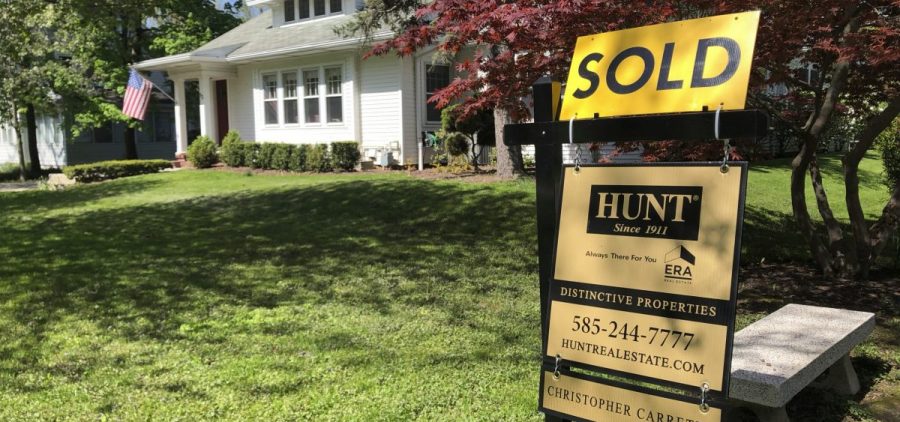 A historic drop in mortgage rates has millions of homeowners refinancing to save money. It's helping home sales, but it's not helping the broader economy as much as it would in a normal recession.