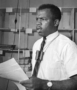 Civil rights leader John Lewis speaks during a news conference in Jackson, Miss., on June 23, 1964.