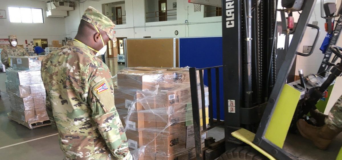 An Ohio National Guard soldier watches a forklift move a load of personal protective equipment as part of a mission in April. This was one of several pandemic-related assignments the Guard has been deployed on since March.