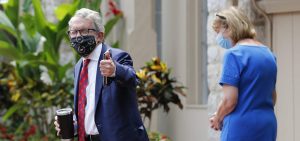 Ohio Governor Mike DeWine, left, and his wife Fran, walk into their residence after he tested positive for COVID-19 earlier in the day Thursday, Aug. 6, 2020, in Bexley, Ohio.