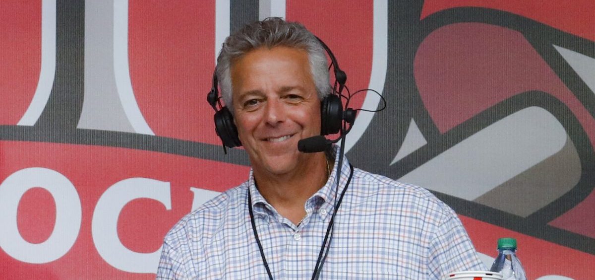 In this Sept. 25, 2019, file photo, Cincinnati Reds broadcaster Thom Brennaman sits in a special outside booth before the Reds' baseball game against the Milwaukee Brewers in Cincinnati. Brennaman used a gay slur during the broadcast of Cincinnati's game against the Kansas City Royals on Wednesday, Aug. 19, 2020. Brennaman used the slur moments after the Fox Sports Ohio broadcast returned from a commercial break before the seventh inning in the first game of a doubleheader. Brennaman did not seem to realize he was already on air.