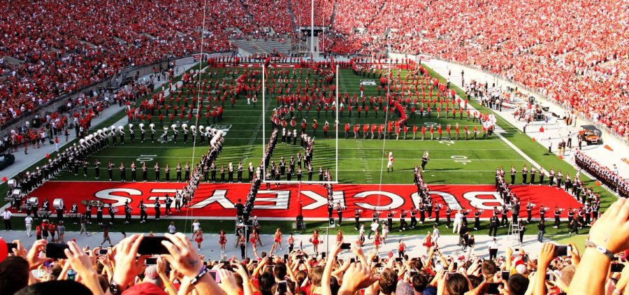 Ohio State Marching Band and Alumni Marching Band Members perform Script Ohio at an Ohio State football game