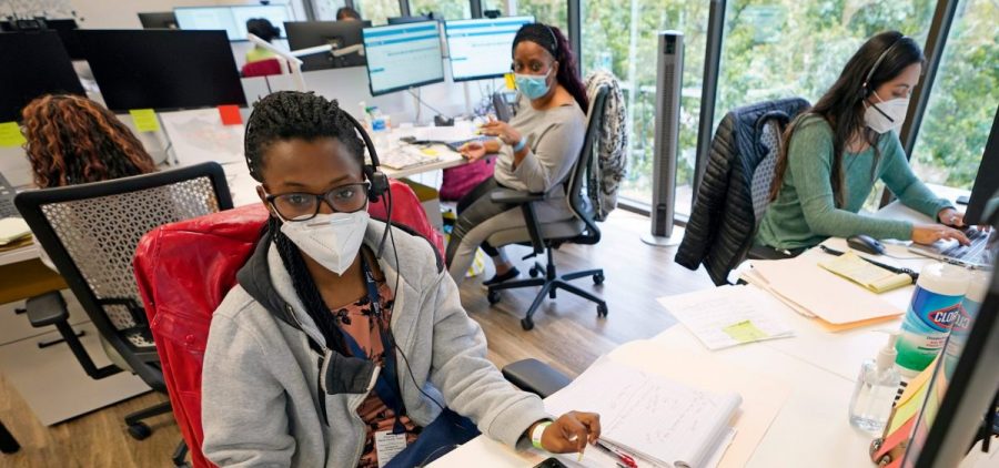 Contact tracers (from left) Christella Uwera, Dishell Freeman and Alejandra Camarillo work at Harris County Public Health Contact Tracing facility in Houston in June.