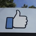 Facebook's thumbs-up "Like" logo is shown on a sign at the company's headquarters in Menlo Park, Calif.