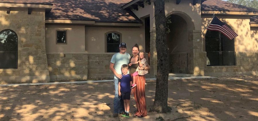 Caroline Wells and her family at their new home outside San Antonio. The builders just finished it so the yard has yet to be planted, but the couple are looking forward to letting the kids run out their energy with a lot more outdoor space than they had at their home in the city.