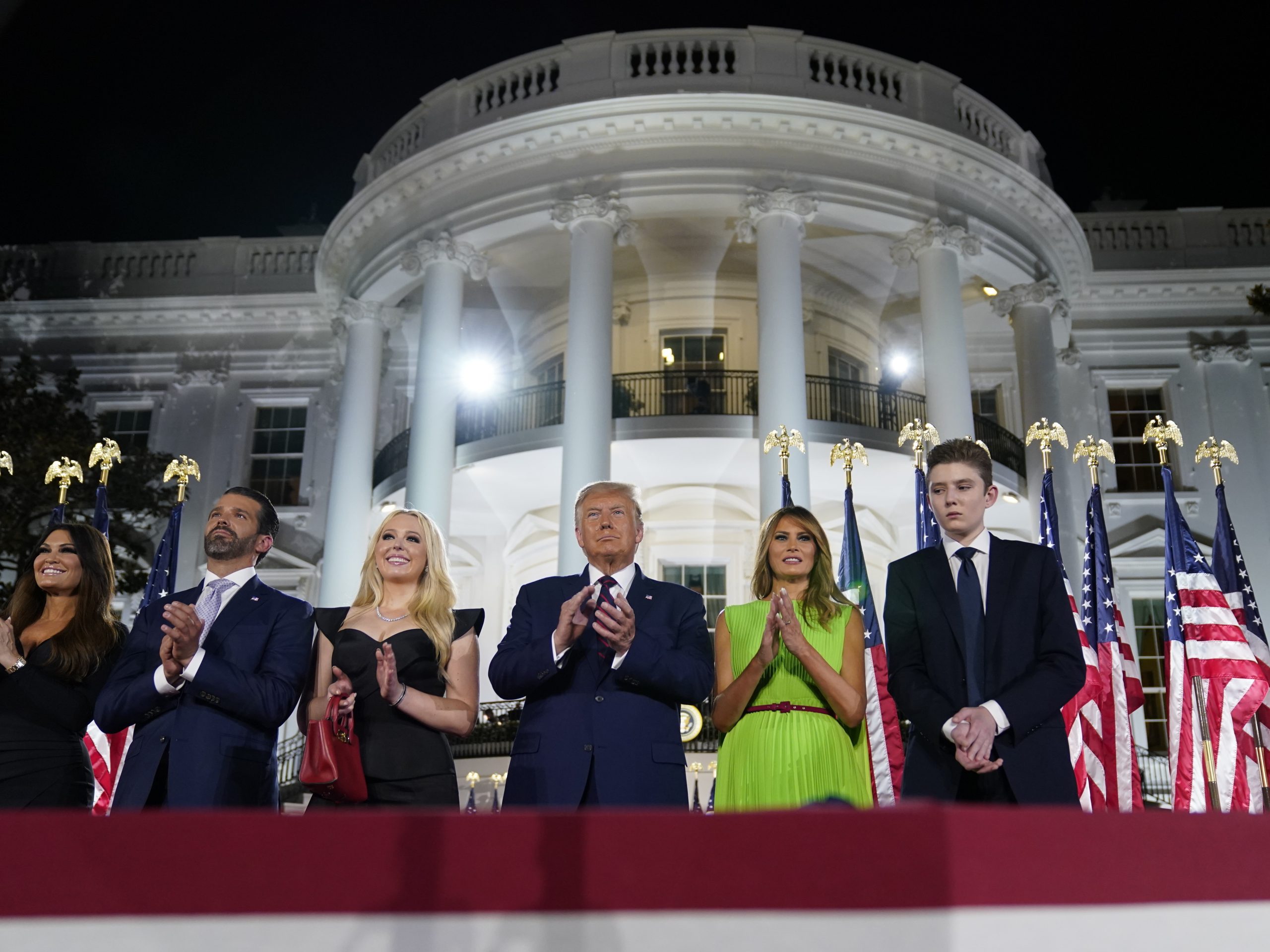 From left, Kimberly Guilfoyle, Donald Trump Jr., Tiffany Trump, President Trump, first lady Melania Trump and Barron Trump stand on the South Lawn of the White House on the last night of the Republican National Convention.