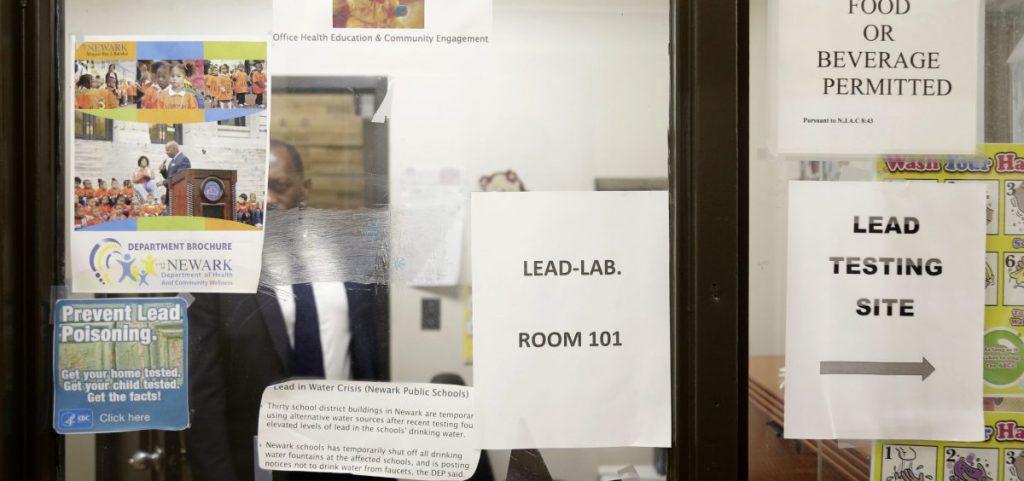 Signs about lead poisoning are posted in the Newark Health Department in Newark, N.J., Wednesday, Aug. 14, 2019.
