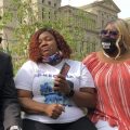 Tamika Palmer, Breonna Taylor's mother, in white beside Attorney Ben Crump, left, speak in Louisville, Ky., after settlement was announced. The city of Louisville will pay $12 million to the family of Breonna Taylor and reform police practices as part of a lawsuit settlement months after Taylor's slaying by police thrust the Black woman's name to the forefront of a national reckoning on race, Mayor Greg Fischer announced Tuesday.