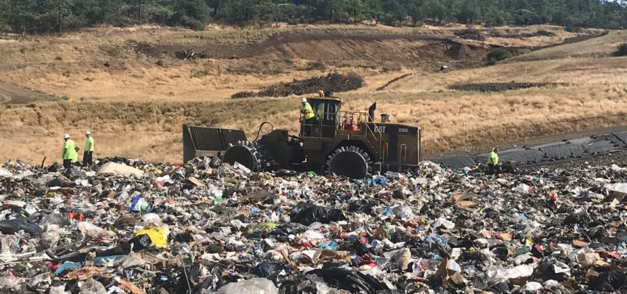 Landfill workers bury all plastic except soda bottles and milk jugs at Rogue Disposal & Recycling in southern Oregon.
