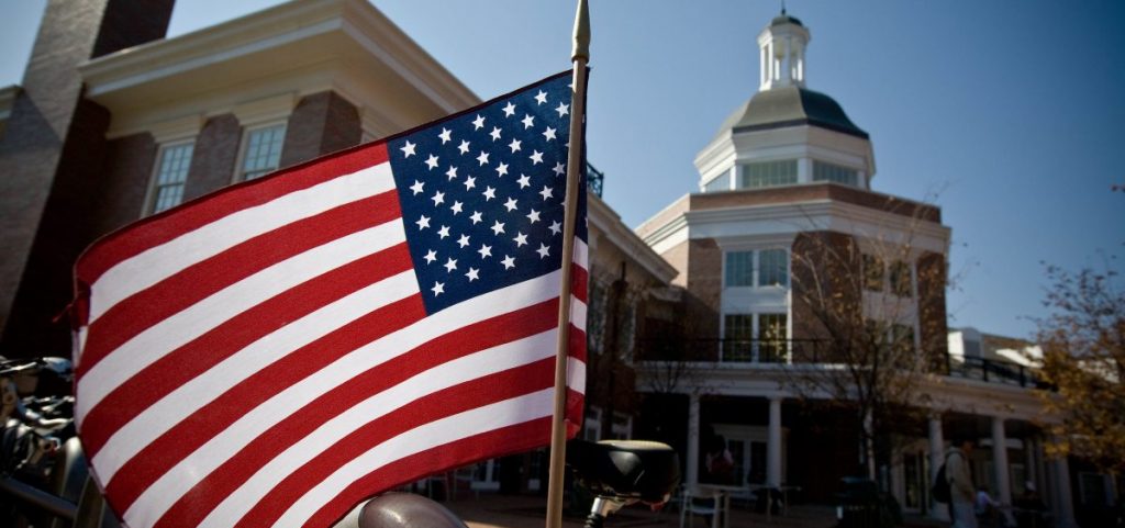 A flag flies near the Obama campaigners outside Baker Center on Tuesday afternoon.