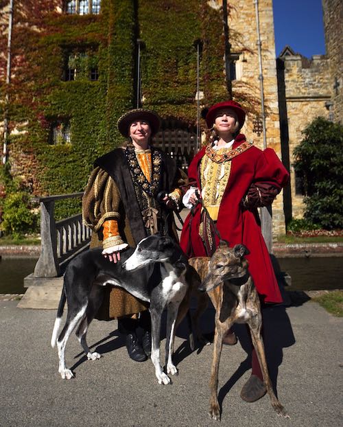 Lucy Worsley in Henry VIII costume with Maria Hayward and dogs at Hever Castle.