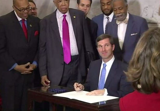 KY Gov. Andy Beshear signs an order restoring some voting rights.