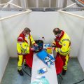 The pending arrival of vaccines has brought "hope for a brighter future," the OECD says. Here, workers from the Red Cross and the Federal Agency for Technical Relief help set up a center for COVID-19 vaccinations in a gymnasium in Eschwege, Germany.