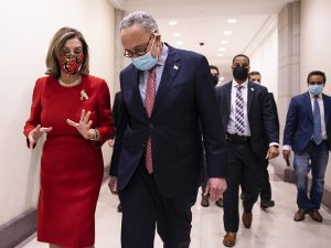 House Speaker Nancy Pelosi, D-Calif., and Senate Minority Leader Chuck Schumer, D-N.Y., speak Sunday following a press conference on Capitol Hill after Republicans and Democrats finally came to an agreement on the coronavirus relief bill.