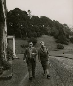 Agatha Christie walks the grounds of Greenway, her beloved country home, with her second husband Max Mallowan.