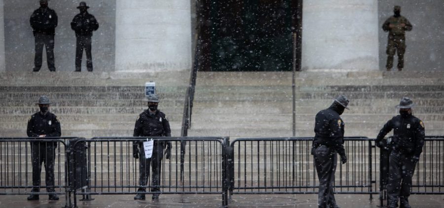 Shio State Troopers and National Guard stand watch at the Ohio Statehouse on Jan. 17 during the planned "armed protest," which remained peaceful.
