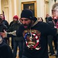 Protesters gesture to U.S. Capitol Police in the hallway outside of the Senate chamber inside the Capitol on Wednesday.