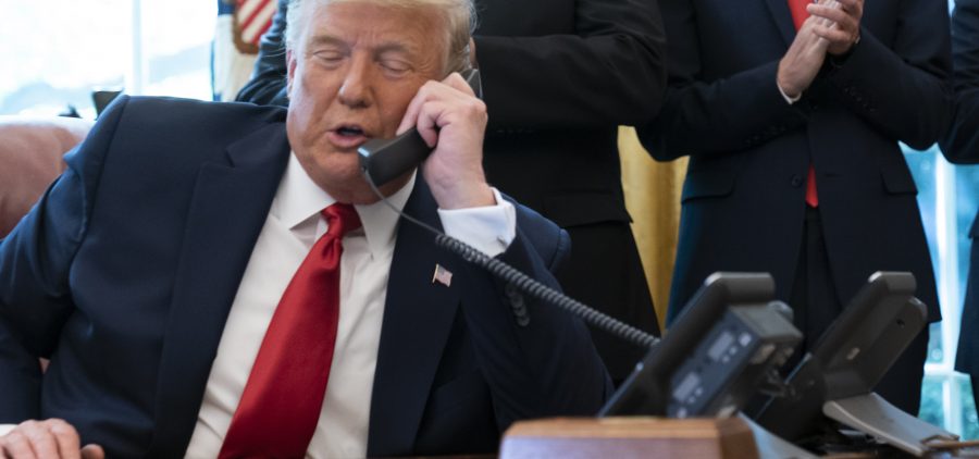 President Trump's phone call on Saturday with Georgia Secretary of State Brad Raffensperger spurred debates over whether the call broke the law. Here, Trump talks to the leaders of Israel and Sudan in October.