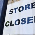 A "store closed" sign is posted at a store in Los Angeles on July 16, 2020. The U.S. economy slowed sharply in the last three months of the year from the previous quarter as the pandemic made a resurgence.