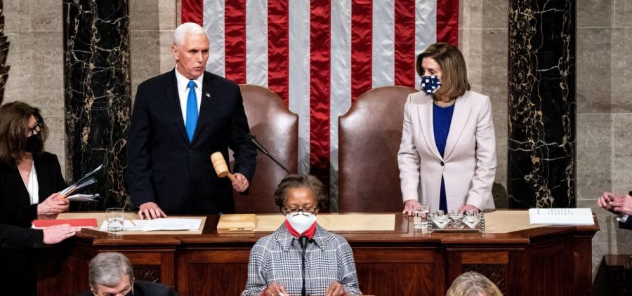 Vice President Mike Pence and House Speaker Nancy Pelosi, D-Calif., preside over a joint session of Congress to ratify President-elect Joe Biden's 306-232 Electoral College win over President Donald Trump, hours after a pro-Trump mob broke into the U.S. Capitol and disrupted proceedings.