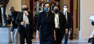 House Speaker Nancy Pelosi, D-Calif., said that impeaching President Trump is "a constitutional remedy that will ensure that the republic will be safe from this man." She's seen here walking to the House floor on Wednesday, ahead of the vote.