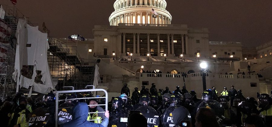 CAP Police and protesters outside the United States Capitol.