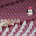 A Cincinnati Reds mascots sits in empty stands during a baseball game against the St. Louis Cardinals at the Great American Ballpark, in Cincinnati, Tuesday, Sept. 1, 2020