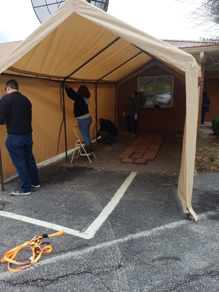 Health workers in Franklin County, KY, use a tent to keep a syringe exchange going in winter.