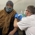 Lorenzo Thomas gets vaccinated at mass vaccination clinic in Columbus
