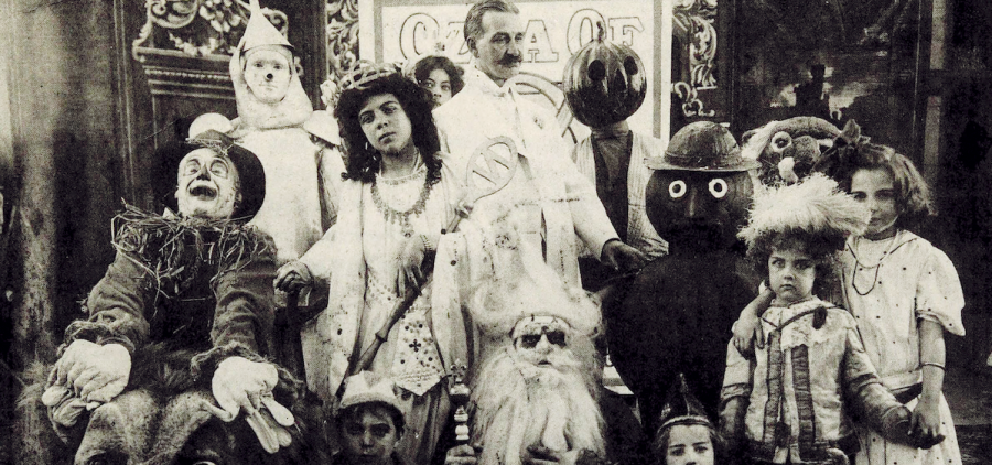 L. Frank Baum (center) surrounded by characters from The Fairylogue and Radio-Plays, a traveling multimedia Oz stage show. Circa 1908.