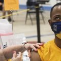 Kent State University student Marz Anderson gets his Johnson & Johnson COVID-19 vaccination from Kent State nurse Beth Krul in Kent, Ohio, Thursday, April 8, 2021.