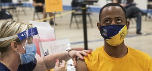 Kent State University student Marz Anderson gets his Johnson & Johnson COVID-19 vaccination from Kent State nurse Beth Krul in Kent, Ohio, Thursday, April 8, 2021.