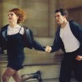 actors playing Romeo and Juliet running down the street