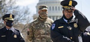 Acting U.S. Capitol Police Chief Yogananda Pittman (right) attends a press briefing about the attack Friday at the U.S. Capitol in Washington, D.C. Pittman announced that one Capitol Police officer died after a man rammed his vehicle into a barrier.
