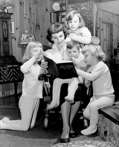 Ruth Graham reads to her four children. 1955.