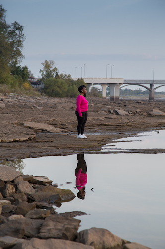 Washington Post reporter DeNeen Brown contemplates a segment of the Arkansas River where forensic archeologists discovered anomalies consistent with possible mass graves. 20 October 2020.