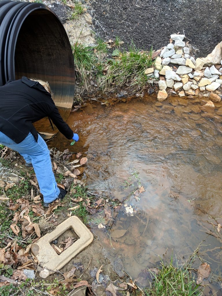Nina McCoy tests stream water near her home in Martin County, Kentucky