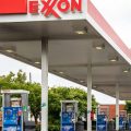 Pictured are pumps at an Exxon gas station in Charlotte, N.C. A tiny fund got two board members elected to the oil giant's board, delivering a historic defeat to ExxonMobil.