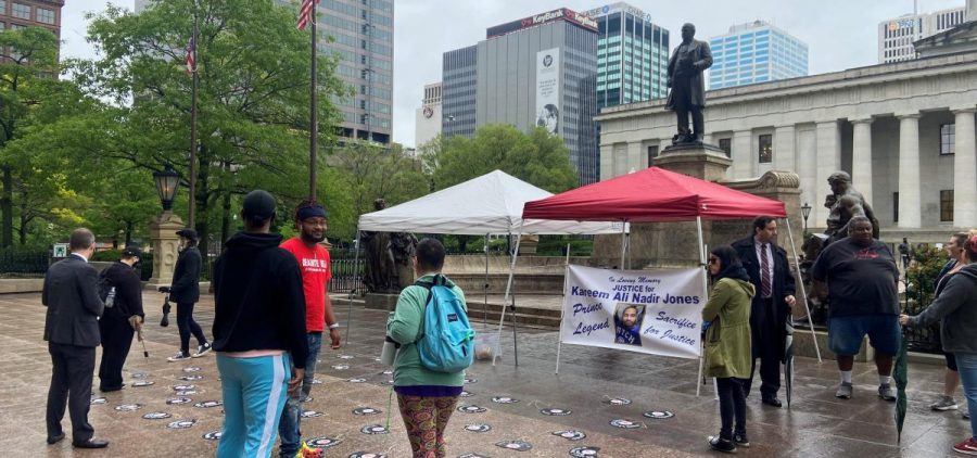 Activists gather at the Ohio Statehouse to announce they’ve filed petitions for a ballot issue to qualified immunity for law enforcement and other public workers. The records on the ground bear the names of people killed in shootings by police officers.
