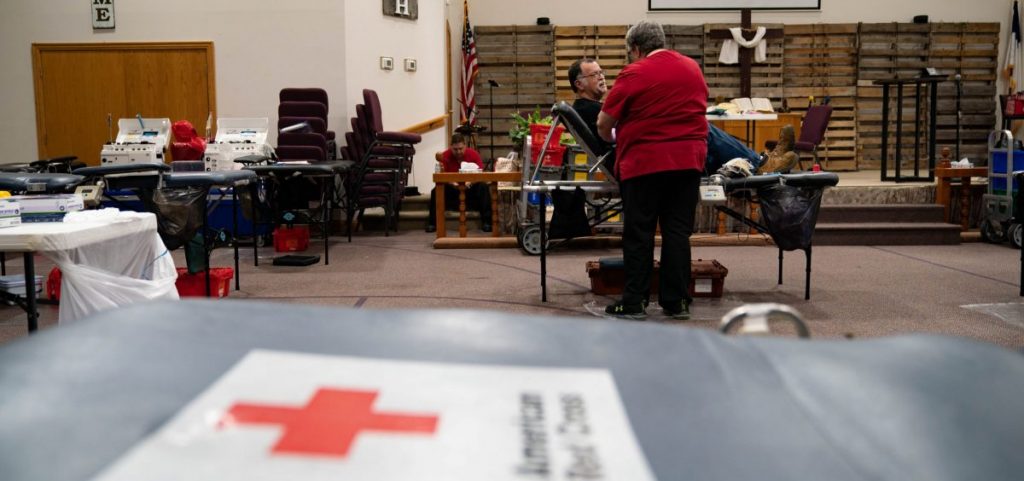 Ken Yuchasz, left, speaks to a red cross employee while donating blood at a donation event for Brinley Boyd, in New Lexington, Ohio, on Thursday, June 24, 2021. Ken, who has been donating blood since high school, lost a son 5 years ago due to medical complications and said the experience reminded him of the importance of blood donation. “This is not something that can be artificially created,” said Ken. “This is something that we can do. And if you can, I encourage you to.” [Joseph Scheller | WOUB]