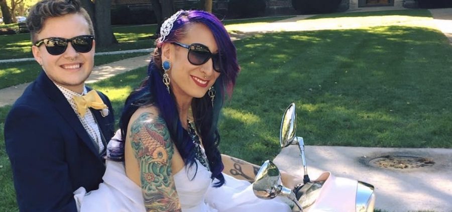 Pam, a gender-queer woman with Brett, a transgender man, on motorcycle