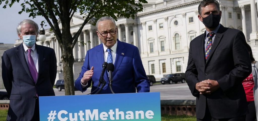 Senate Majority Leader Chuck Schumer, joined by Sens. Ed Markey (left) and Martin Heinrich, discusses legislation in April to reimpose regulations to reduce methane pollution from oil and gas wells.
